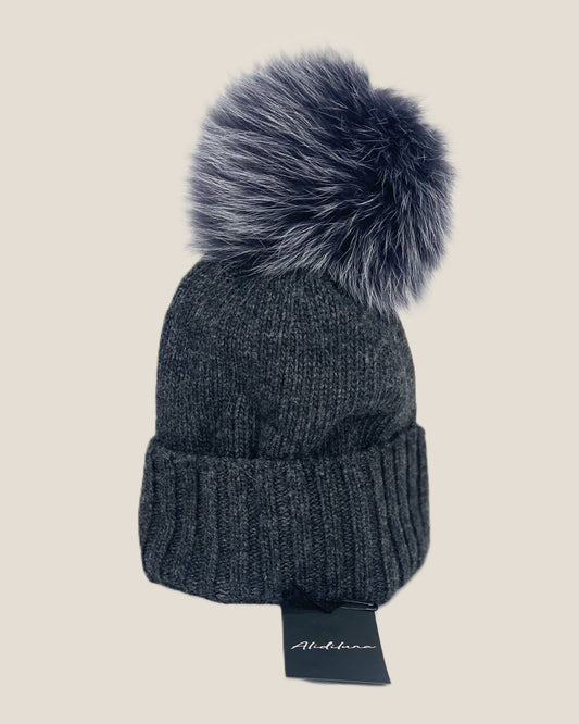 Women's hat with dark grey fox pom pom